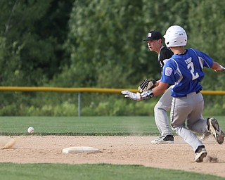 Poland second baseman Brody Todd (2) slides into second base as Boardman second baseman Steven Hiner (6) waits for the ball in the second inning as Boardman takes on Poland, Friday, July 7, 2017, at Fields of Dreams in Boardman. Poland won 12-7...(Nikos Frazier | The Vindicator)..