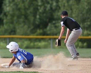 Poland second baseman Brody Todd (2) slides into second base as Boardman second baseman Steven Hiner (6) misses the ball in the second inning as Boardman takes on Poland, Friday, July 7, 2017, at Fields of Dreams in Boardman. Poland won 12-7...(Nikos Frazier | The Vindicator)..