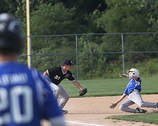 Boardman third baseman Anthony Micco (33) leans down to tag out Poland catcher Ian Francis (1) in the second inning as Boardman takes on Poland, Friday, July 7, 2017, at Fields of Dreams in Boardman. Poland won 12-7...(Nikos Frazier | The Vindicator)..