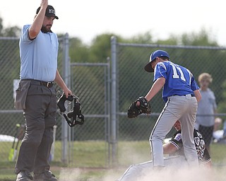Poland pitcher Mason Planey (11) runs to tag out Boardman third baseman Anthony Micco (33) as he slides into home in the second inning as Boardman takes on Poland, Friday, July 7, 2017, at Fields of Dreams in Boardman. Poland won 12-7...(Nikos Frazier | The Vindicator)..