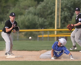Poland second baseman Brody Todd (2) slides into second as Boardman second baseman Steven Hiner (6) waits for the ball in the third inning as Boardman takes on Poland, Friday, July 7, 2017, at Fields of Dreams in Boardman. Poland won 12-7...(Nikos Frazier | The Vindicator)..