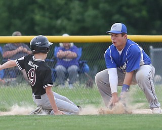 Boardman left fielder Justin Maloney (9) slides back into third as Poland third baseman Christian Colosimo (20) leans down for the catch in the fourth inning as Boardman takes on Poland, Friday, July 7, 2017, at Fields of Dreams in Boardman. Poland won 12-7...(Nikos Frazier | The Vindicator)..