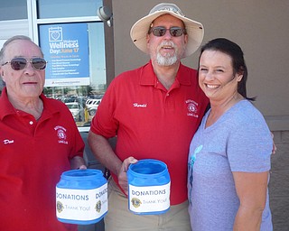 The Austintown Lions Club held one of its three annual mint-candy days recently at the Austintown Walmart. The Lions accepted donations and gave mints to those who contributed. The Lions extend a thank-you to those who donate to its many causes, helping the sight impaired, the community and many other services provided by the Lions Club. Anyone interested in learning more about Lions and the services provided should contact Lion Bob Whited at 330-792-7907 or olebert1@aol.com. Above, from left, are Lions Don Hoelzel and Harold Wilson with contributor Shelley Kacensky.
