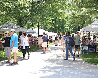 Walkways lined with vendors filled the campus of Youngstown State University during the Summer Festival of the Arts on Saturday afternoon.  Dustin Livesay  |  The Vindicator  7/8/17  Youngstown State University.