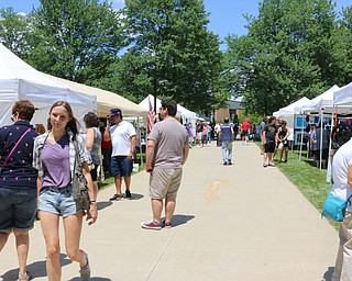Walkways lined with vendors filled the campus of Youngstown State University during the Summer Festival of the Arts on Saturday afternoon.  Dustin Livesay  |  The Vindicator  7/8/17  Youngstown State University.