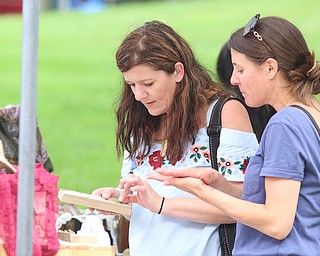 R-L) Angela Dipiero of Cleveland looks through jewelry with her stepmother Beth Dipiero of Girard during the Summer Festival of the Arts at Youngstown State University on Saturday afternoon.  Dustin Livesay  |  The Vindicator  7/8/17  Youngstown State University.