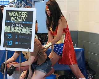 April Yurkovich of Canfield gives messages as Wonder Woman during the All Americon convention at the Covelli Center in Youngstown on Saturday afternoon.  Dustin Livesay  |  The Vindicator  7/8/17  Covelli Center.