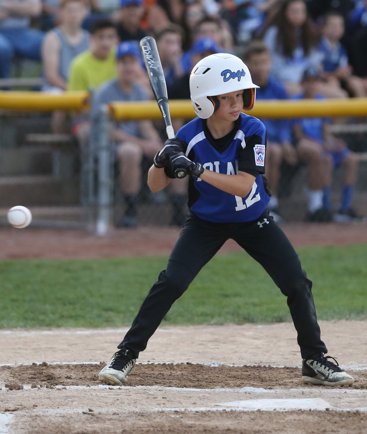 Poland second baseman Tegan McCurdy (12) watches the strike fly by in the first inning against Canfield/Poland, Sunday, July 9, 2017, at Fields of Dreams in Boardman. Canfield won 11-0...(Nikos Frazier | The Vindicator)..