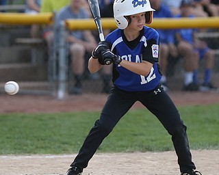 Poland second baseman Tegan McCurdy (12) watches the strike fly by in the first inning against Canfield/Poland, Sunday, July 9, 2017, at Fields of Dreams in Boardman. Canfield won 11-0...(Nikos Frazier | The Vindicator)..