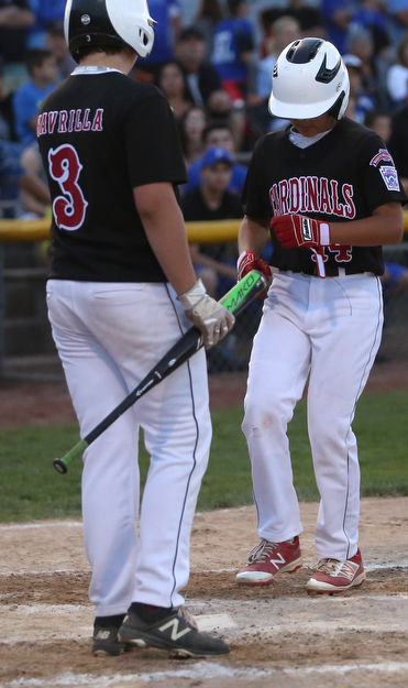 Canfield short stop Ben Slanker (14) crosses home on a three run home run in the second inning against Canfield/Poland, Sunday, July 9, 2017, at Fields of Dreams in Boardman. Canfield won 11-0...(Nikos Frazier | The Vindicator)..