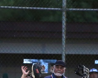 Canfield catcher Broc Lowry (27) looks up to catch the ball to out Poland  Connor Hudran's (10) bunt in the third inning against Canfield/Poland, Sunday, July 9, 2017, at Fields of Dreams in Boardman. Canfield won 11-0...(Nikos Frazier | The Vindicator)..