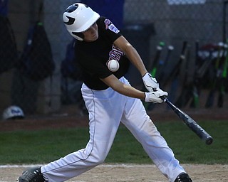 Canfield catcher Broc Lowry (27) swings in the third inning against Canfield/Poland, Sunday, July 9, 2017, at Fields of Dreams in Boardman. Canfield won 11-0...(Nikos Frazier | The Vindicator)..