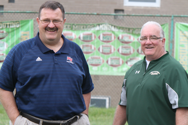 William D Lewis the vindictor   Malone College Football Coach Frank thomas, left,and Ursuline Football Coach Larry Kempe talk  during a football camp at Ursuline HS 7-10-17.