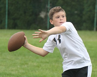 William D Lewis the vindictor   Dylan Casey, 12, of Liberty passes during a football camp at Ursuline HS 7-10-17.