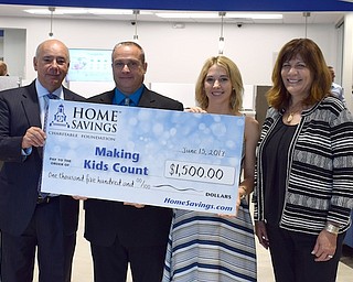 Home Savings Charitable Foundation has donated $1,500 to Making Kids Count. Funds will be used for the Comfort Kit Program, which ensures infants, children and teens who enter foster care will receive a hopeful start by giving them care bags to replace items they were forced to leave behind. For information, call 330-758-3434 or visit makingkidscount.org. Above from left are Frank Hierro, Mahoning Valley regional president; Frank Constantino, branch manager, Home Savings Boardman office; Shelly Marlowe, co-president, Making Kids Count; and Karen DeAmicis, vice-president, Home Savings NE Division sales manager.