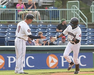 Mahoning Valley Scrappers second baseman Samad Taylor (1) high fives Mahoning Valley Scrappers manager Luke Carlin (11) after his two run home run in the first inning as the Mahoning Valley Scrappers take on the Brooklyn Cyclones, Tuesday, July 11, 2017, at Eastwood Field in Niles...(Nikos Frazier | The Vindicator)..