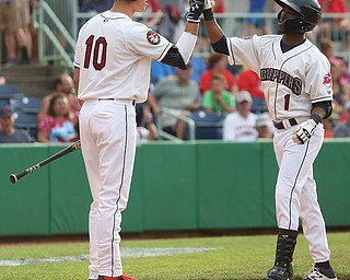 Mahoning Valley Scrappers second baseman Samad Taylor (1) high fives Mahoning Valley Scrappers third baseman Nolan Jones (10) after hitting a two run home run in the first inning as the Mahoning Valley Scrappers take on the Brooklyn Cyclones, Tuesday, July 11, 2017, at Eastwood Field in Niles...(Nikos Frazier | The Vindicator)..