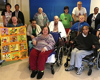More than 60 seniors participated recently in the seventh annual “Centered: Slightly Off-Center” senior citizen art show. Among the participants above, standing from left are Anna Creque, adviser; Claudette Cook; Rose Thomae; Tami Sandford; Ron Byers; and Khalilah Jordan, adviser. Middle from left are Bill Hegedusich, Maria Dinsio, Jennifer Robinson, John Thut, Donna Adams and Betty Kelly. Seated from left are Barb Cappiello and Teresa Hickson. Below are Suzanne Gray, painting instructor for all of the centers, and Byers, who won Best of Show.