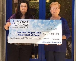 Home Savings Charitable Foundation recently donated $2,000 to Lou Holtz/Upper Ohio Valley Hall of Fame. The funds were used to sponsor the 2017 Lou Holtz/Upper Ohio Valley Hall of Fame induction banquet. The Hall of Fame is a museum for sports and history. It’s purpose is to recognize people from the Upper Ohio Valley who inspire young people. Above, from left, are Cathy Grafton, retail manager, Home Savings East Liverpool office, and Rosemary Mackall, director of development, Lou Holtz/Upper Ohio Valley Hall of Fame.