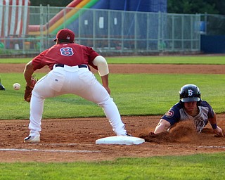 Scrappers first basemen Ulysses Cantu (8) reaches for the ball as Brooklyn's Reed Gamache (11) slides in safely during Wednesday nights matchup at Eastwood Field.   Dustin Livesay  |  The Vindicator  7/12/17  Eastwood Field.