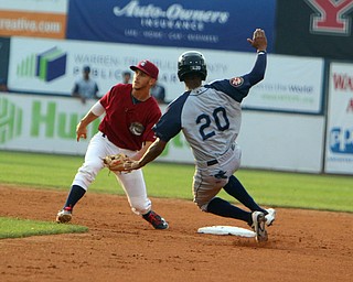 Scrappers short stop Jesse Berardi (32) catches a ball at second base just missing the tag out on Brooklyns Jose Miguel Medina (20) during Wednesday nights matchup at Eastwood Field.   Dustin Livesay  |  The Vindicator  7/12/17  Eastwood Field.