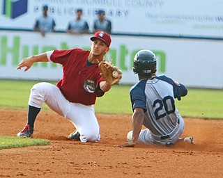 Scrappers short stop Jesse Berardi (32) catches a ball at second base just missing the tag out on Brooklyns Jose Miguel Medina (20) during Wednesday nights matchup at Eastwood Field.   Dustin Livesay  |  The Vindicator  7/12/17  Eastwood Field.
