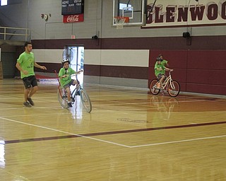 Neighbors | Alexis Bartolomucci.Children rode bikes around the gymnasium at Glenwood Middle School with the help of the volunteers during the iCan Bike camp.