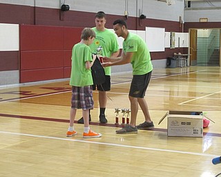 Neighbors | Alexis Bartolomucci.Volunteers passed out trophies, a certificate and a backpack to the riders involved in the iCan Bike camp at Glenwood Middle School.