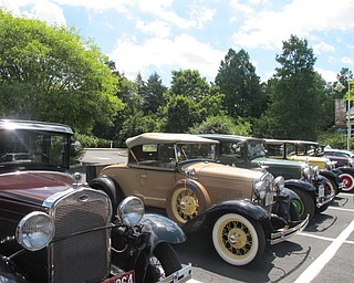 Neighbors | Alexis Bartolomucci.Model A cars lined up at Fellows Riverside Gardens on June 21 as part of the Penn Ohio 'A' Ford Club's tour through Youngstown.