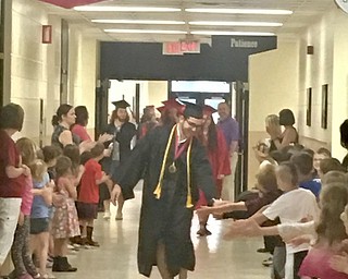 Neighbors | Submitted.On June 5, Canfield High School 2017 graduate, and Hilltop Elementary School alumni, Jad Saleh greeted Hilltop Elementary students as he and his fellow graduates walked the halls of the school during a Clap Out.