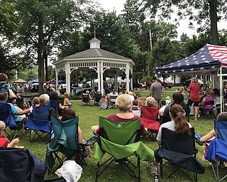 Neighbors | Alexis Bartolomucci.Guests at Celebrate Poland sat around the gazebo and watched people sing during Poland Idol on July 1.