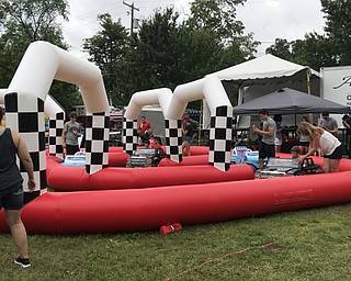 Neighbors | Alexis Bartolomucci.Children rode around a racetrack on motorized cars during the Celebrate Poland event at the Poland Village Town Hall.