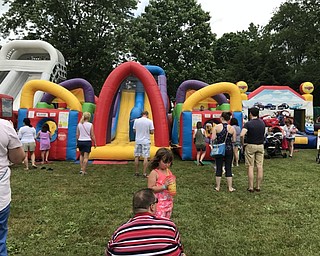 Neighbors | Alexis Bartolomucci.Inflatable slides and bounce houses were set up on July 1 for children to play on for the Celebrate Poland event.