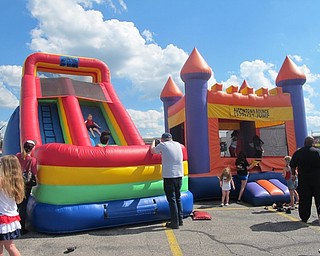 Neighbors | Alexis Bartolomucci.Bounce houses and inflatables were provided by Austintown Bounce for children to enjoy during the fifth annual fireworks celebration on July 2 at the Austintown Plaza.