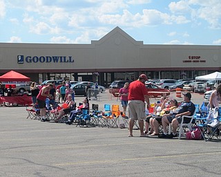 Neighbors | Alexis Bartolomucci.Guests at the Austintown fireworks celebration set out chairs as they waited for the bands to take the stage to provide entertainment for the night.