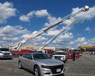 Neighbors | Alexis Bartolomucci.Service cars and trucks were parked at the Austintown Plaza on July 2 for the guests to look at up close during the annual fireworks celebration.