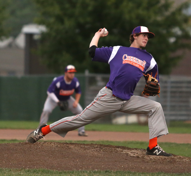 Creekside pitcher TJ Deshield (22) throws in the first inning as Creekside Fitness takes on the Golden Spikes, Friday, July 14, 2017, at Bob Cene Park in Struthers...(Nikos Frazier | The Vindicator)..