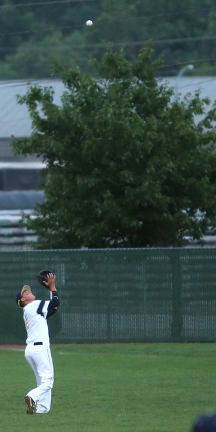 Golden Spikes second baseman Kyle Karchefsky (12) runs to the outfield for the out in the first inning as Creekside Fitness takes on the Golden Spikes, Friday, July 14, 2017, at Bob Cene Park in Struthers...(Nikos Frazier | The Vindicator)..