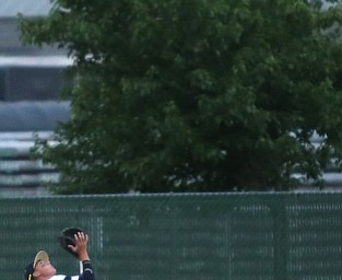 Golden Spikes second baseman Kyle Karchefsky (12) runs to the outfield for the out in the first inning as Creekside Fitness takes on the Golden Spikes, Friday, July 14, 2017, at Bob Cene Park in Struthers...(Nikos Frazier | The Vindicator)..