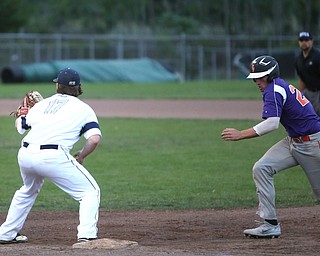 Creekside right fielder Eric Sapp (23) runs back to first as Golden Spikes first baseman Donny Watters (17) waits for the ball in the second inning as Creekside Fitness takes on the Golden Spikes, Friday, July 14, 2017, at Bob Cene Park in Struthers...(Nikos Frazier | The Vindicator)..