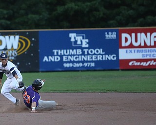 Creekside right fielder Eric Sapp (23) slides into Golden Spikes second baseman Kyle Karchefsky (12) on a steal in the second inning as Creekside Fitness takes on the Golden Spikes, Friday, July 14, 2017, at Bob Cene Park in Struthers...(Nikos Frazier | The Vindicator)..