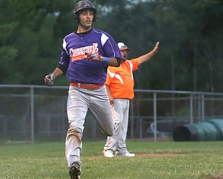 Creekside left fielder Aex Hernandez (29) scores in the third inning as Creekside Fitness takes on the Golden Spikes, Friday, July 14, 2017, at Bob Cene Park in Struthers...(Nikos Frazier | The Vindicator)..