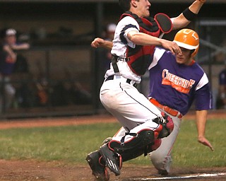 Creekside designated hitter Dom Pecchia (10) slides past Golden Spikes catcher Eli Erhbar (41) to scores a run in the third inning as Creekside Fitness takes on the Golden Spikes, Friday, July 14, 2017, at Bob Cene Park in Struthers...(Nikos Frazier | The Vindicator)..
