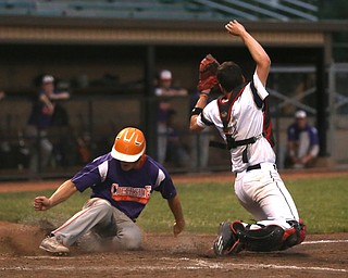 Creekside designated hitter Dom Pecchia (10) slides past Golden Spikes catcher Eli Erhbar (41) to scores a run in the third inning as Creekside Fitness takes on the Golden Spikes, Friday, July 14, 2017, at Bob Cene Park in Struthers...(Nikos Frazier | The Vindicator)..