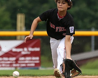 MICHAEL G TAYLOR | THE VINDICATOR-7-15-17  BASEBALL 8-10 yrs. Ohio D2 Championship- Boardman Spartans vs Canfield Cardinals at Field of Dreams in Boardman, OH. 2nd,  Canfield's #27 Zain Jadallah fielding the ball.