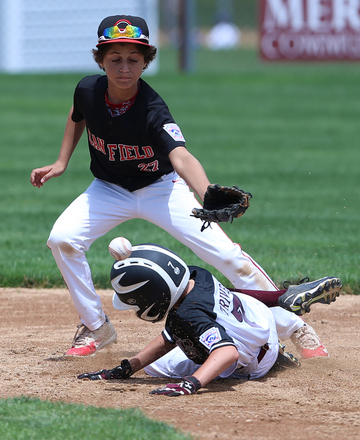 MICHAEL G TAYLOR | THE VINDICATOR-7-15-17  BASEBALL 8-10 yrs. Ohio D2 Championship- Boardman vs Canfield at Field of Dreams in Boardman, OH. 6th, Boardman's #7 Anthony Triveri steals 2nd under as  Canfield's#27 Zain Jadallah takes the throw