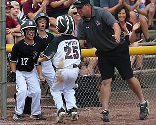 MICHAEL G TAYLOR | THE VINDICATOR-7-15-17  BASEBALL 8-10 yrs. Ohio D2 Championship- Boardman Spartans vs Canfield Cardinals at Field of Dreams in Boardman, OH. 2nd, Boardman's #25 Max Switka celebrates scoring with his teammates