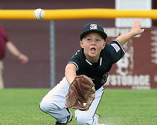 MICHAEL G TAYLOR | THE VINDICATOR-7-15-17  BASEBALL 8-10 yrs. Ohio D2 Championship- Boardman Spartans vs Canfield Cardinals at Field of Dreams in Boardman, OH. 2nd, Boardman's #42 Mikey Demetrios makes a diving attempt to catch the ball.