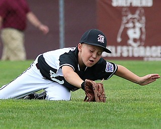 MICHAEL G TAYLOR | THE VINDICATOR-7-15-17  BASEBALL 8-10 yrs. Ohio D2 Championship- Boardman Spartans vs Canfield Cardinals at Field of Dreams in Boardman, OH. 2nd, Boardman's #42 Mikey Demetrios makes a diving attempt to catch the ball.