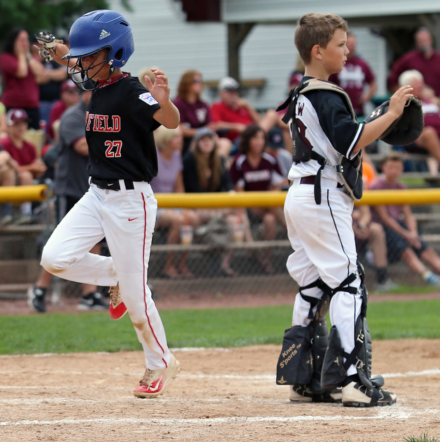 MICHAEL G TAYLOR | THE VINDICATOR-7-15-17  BASEBALL 8-10 yrs. Ohio D2 Championship- Boardman vs Canfield at Field of Dreams in Boardman, OH. 2nd, Canfield's #27 Zain Jadallah scores.